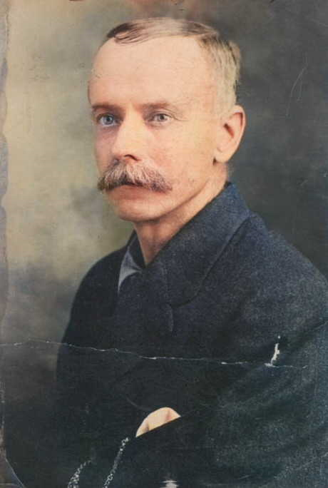 A person with a mustache

Description automatically generated
